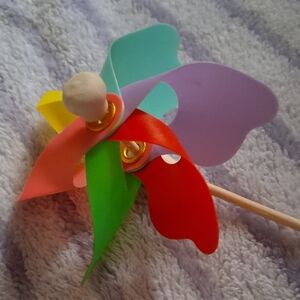 A Vintage Pinwheel with Wood Dollies & Metal